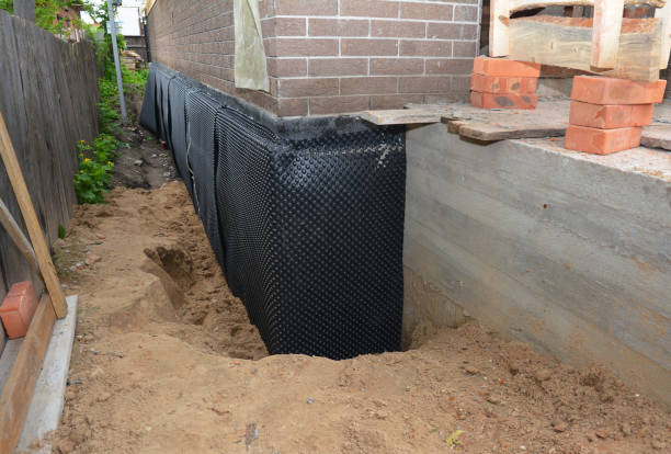 Happy homeowners after waterproofing job in Odon
